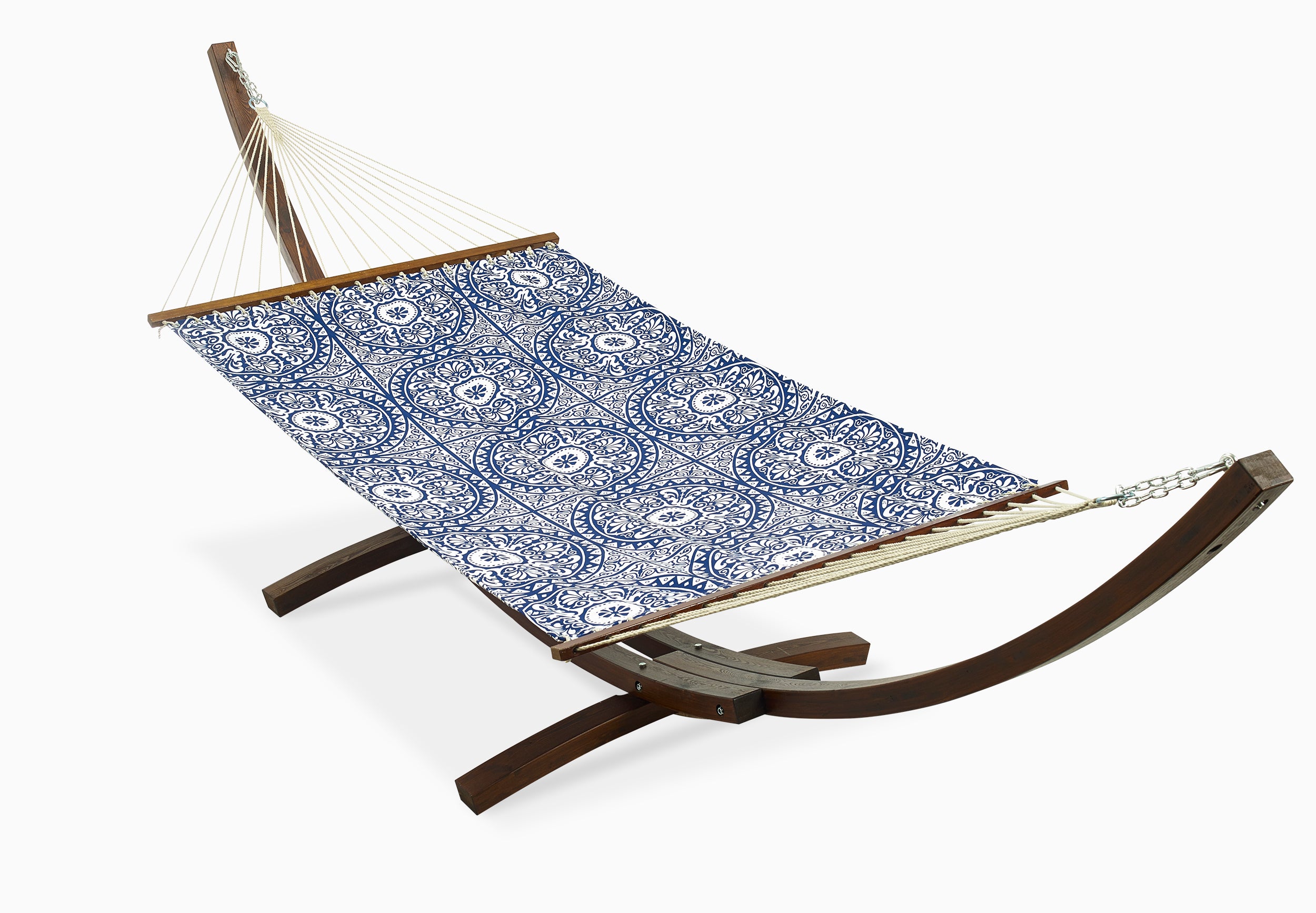 Full view of blue tile print hammock hung on a curved wooden stand